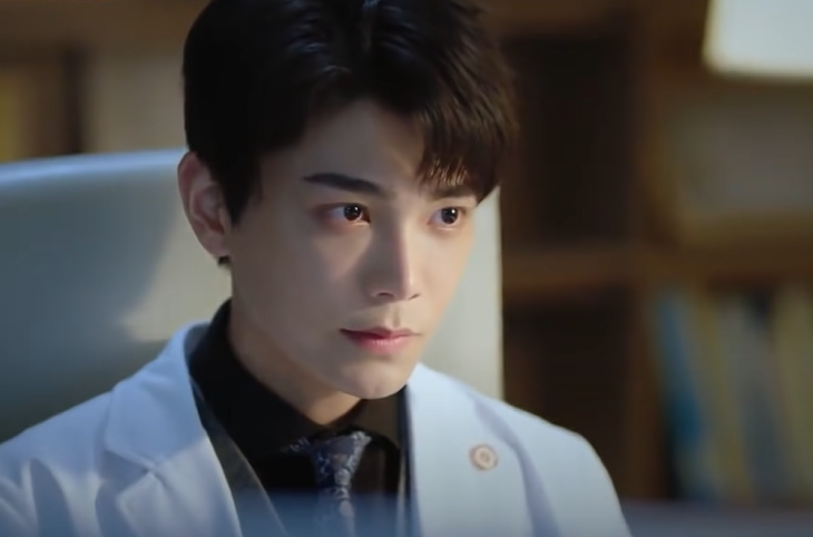 Ding Yuxi in white medical coat